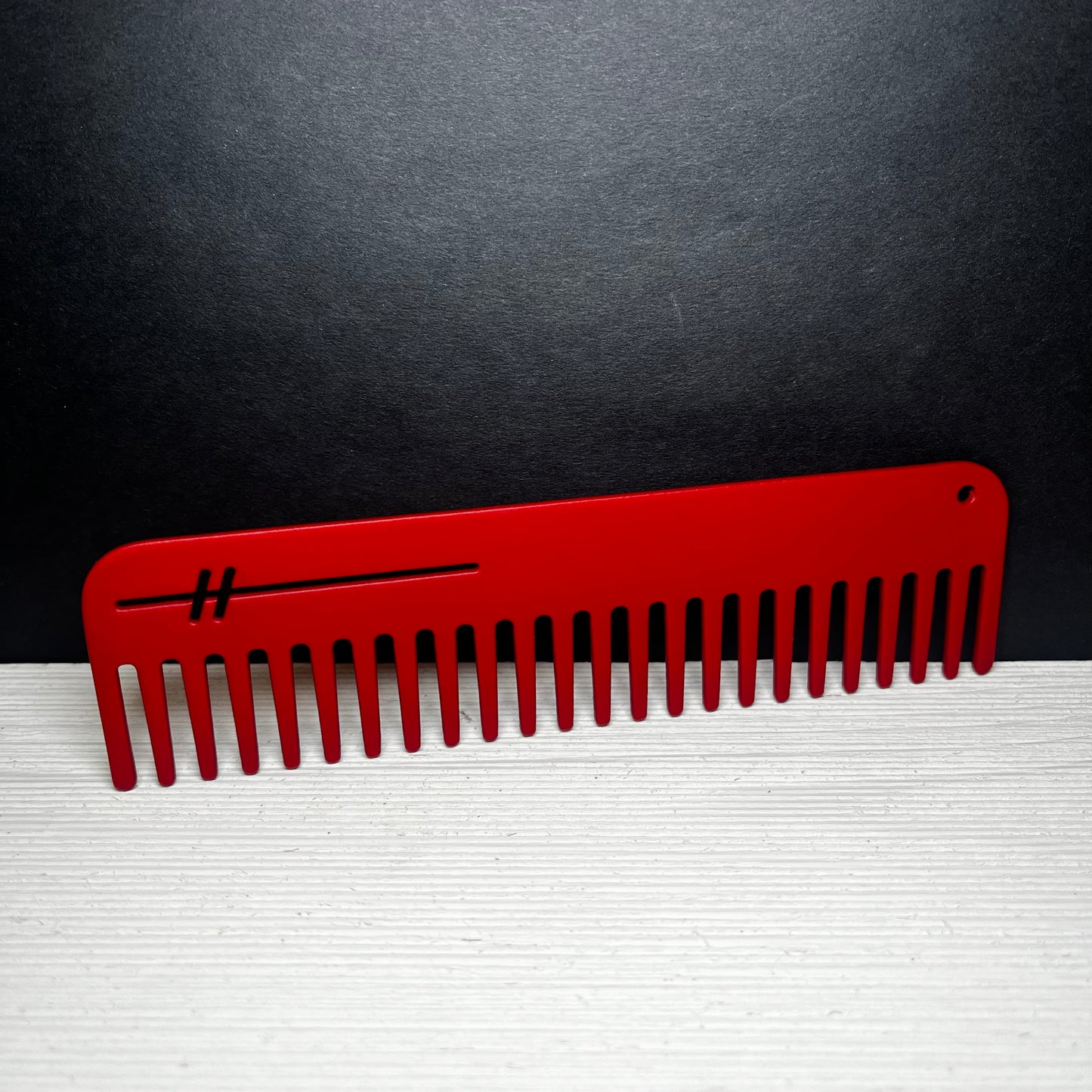 Heircomb Abbey Wide Tooth Metal Comb in Matte Red finish.