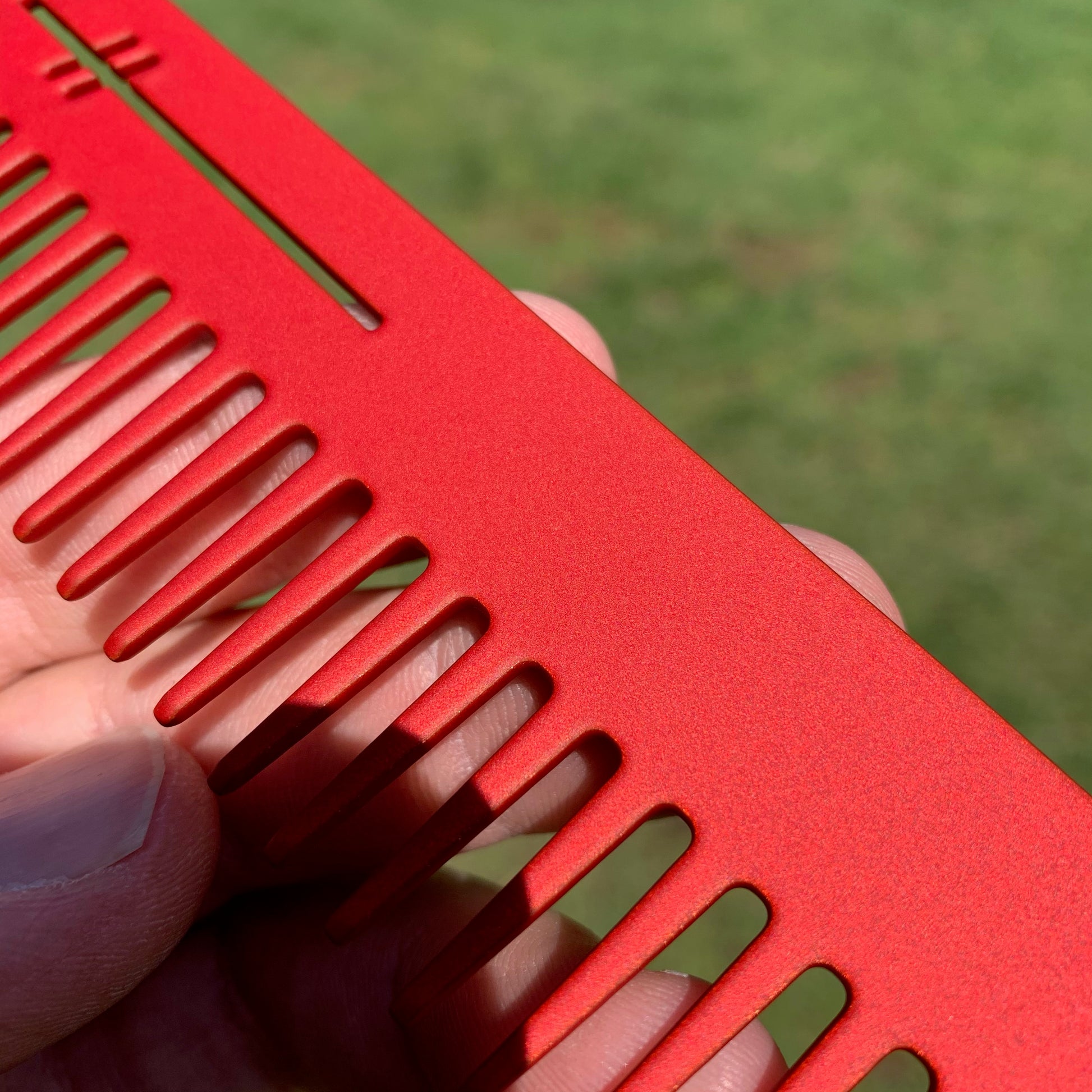 Heircomb Abbey Wide Tooth Metal Comb in Matte Red finish.