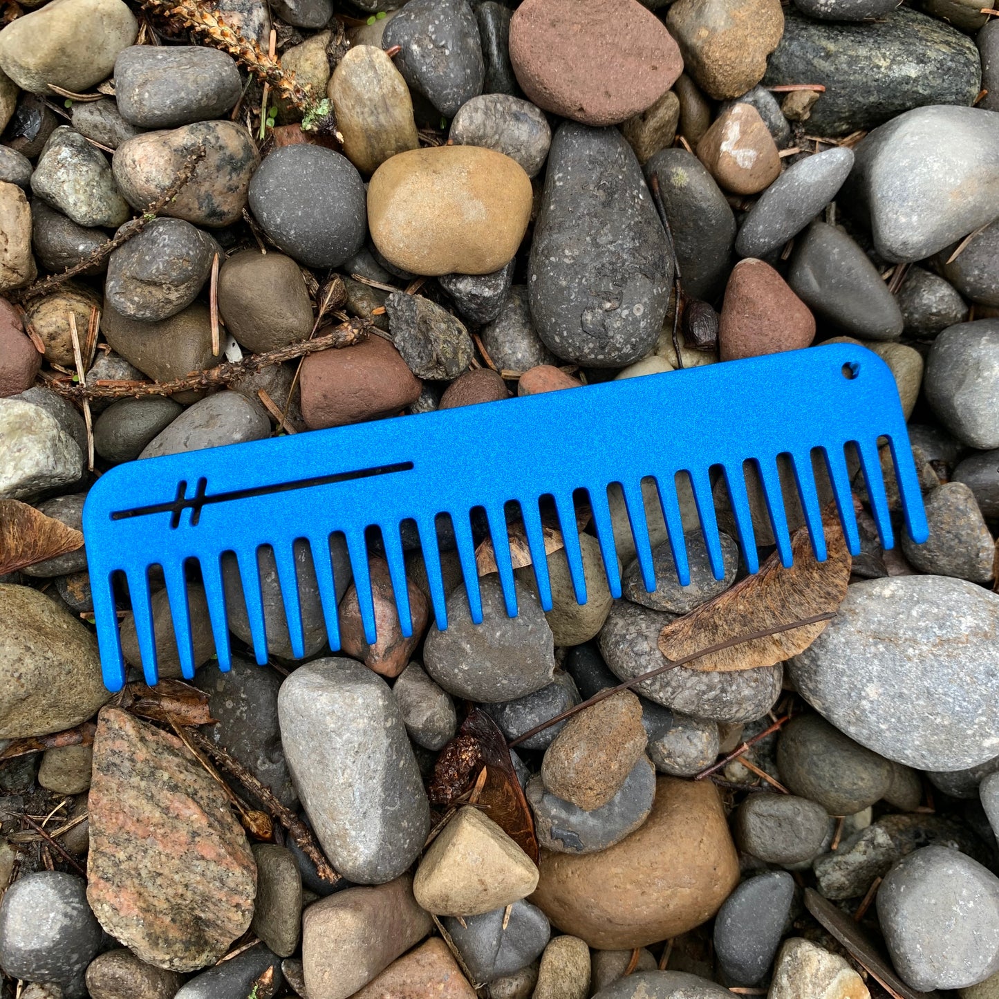 Heircomb Abbey Wide Tooth Metal Comb in Matte Blue finish.